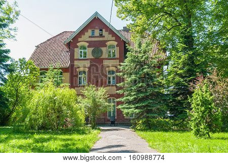 Yantarny, Russia - June 22, 2010: Old house with sberbank office in German style in summer day. Kaliningrad region