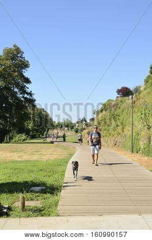 TUI, SPAIN - AUGUST 7, 2016: People walking in a pathway in Tui a town of the province of Pontevedra in Galicia Spain.