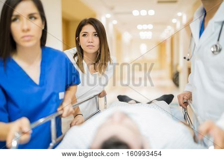 Transporting Patient In A Hospital Hallway