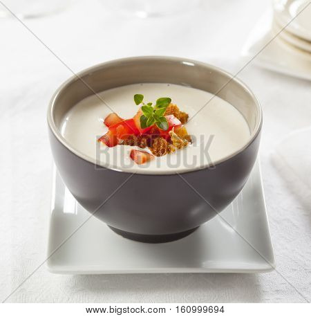 Traditional Spanish cold soup ajoblanco (garlic with almonds white wine vinegar olive oil and grapes)