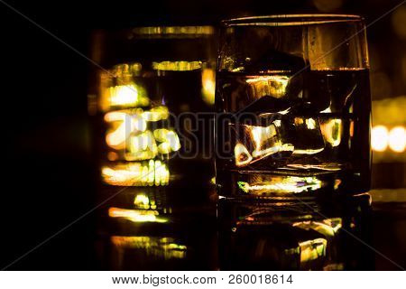 Colored Lighting Of Glasses In The Night Club Bar