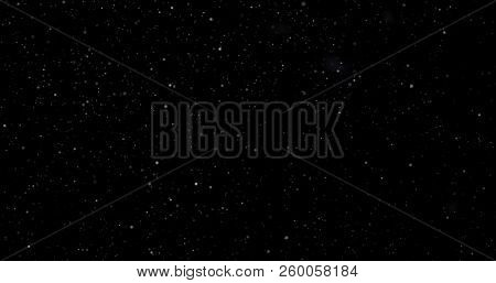 Flying Dust Particles On A Black Background