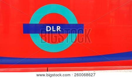 London, Ukn - August 18, 2018: Close Up Of Dlr Logo On The Side Of A Stationary Train.