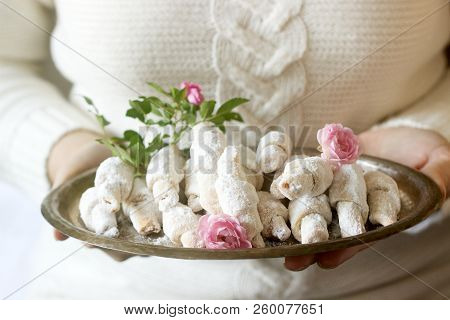 Traditional Romanian Or Moldavian Shortcake Cookies With Jam Stuffing On A Tray In Female Hands.