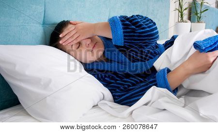 Closeup Portrait Of Young Sick Wome With Headache Holding Hand On Forehead