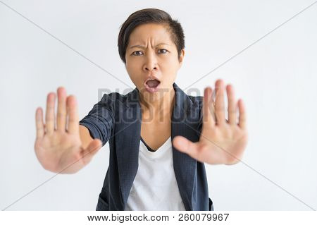 Worried Woman Showing Stop Gesture With Palms. Young Lady Frowning And Screaming. Stop Gesture Conce