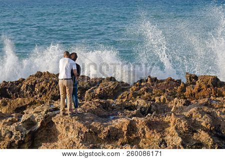 Port Elizabet, South Africa - September 12: Pair Of Lovers Observe A Waves Break In The Port Elizabe