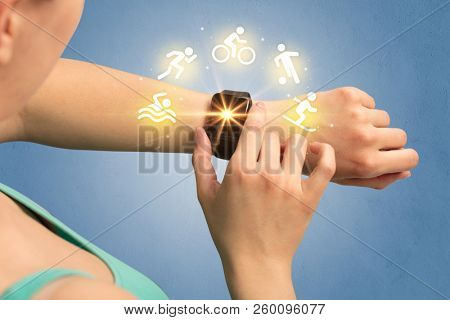 Female hand with smartwatch and sport concept.