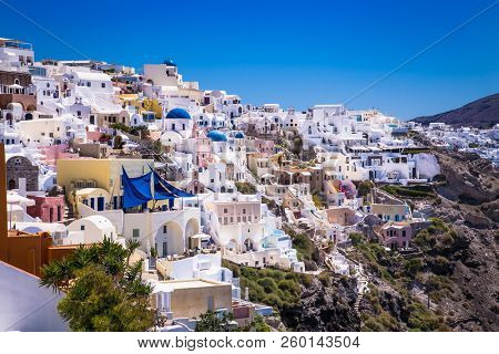 Panoramic view on Oia village at suny day , Santorini island, Greece.