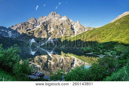 Mountain Rysy and flood Morskie Oko, High Tatry, Poland, May 27, 2018.