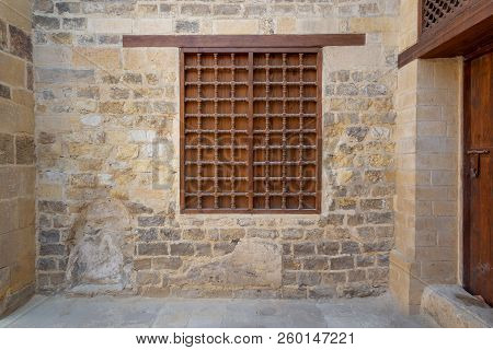 Mamluk Era Wooden Closed Window With Wooden Ornate Grid Over Stone Bricks Wall, Cairo, Egypt
