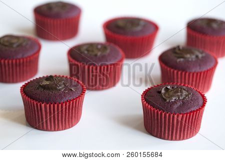 Just Baked Chocolate Muffins. Chocolate Cupcakes. Just Baked  Chocolate Cupcakes On A White Wooden T