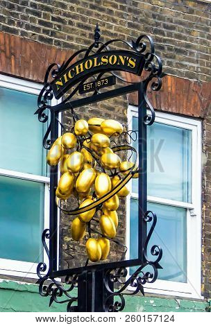 London,uk - June 9, 2015: Nicholson Hoop And Grapes Pub Sign. London . Traditional British Pub In Th