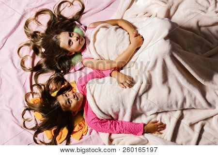 Schoolgirls In Pink Pajamas Wallow On Colorful Pillows, Topview