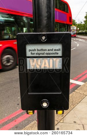 Crosswalk Button For Pedestrian With Light Warning. London. Uk