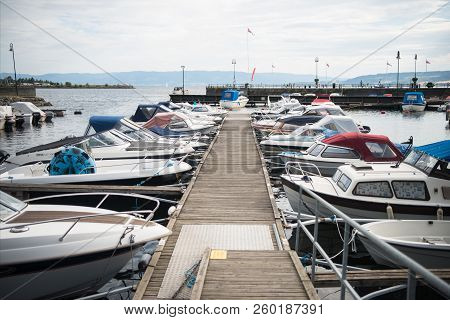 Hamar, Hedmark, Norway - 26 July 2018: Moored Boats Near Wooden Pier