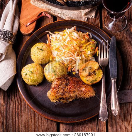 Classic And Crispy Roasted Duck With Cabbage And Dumplings