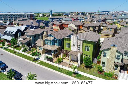 Colorful Homes In New Urban Development Aerial Drone View Of Solar Panels Covered All The Rooftops I