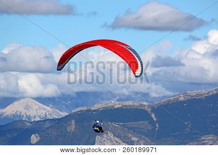 Paraglider Flying In The French Alps From The Chabre Mountain