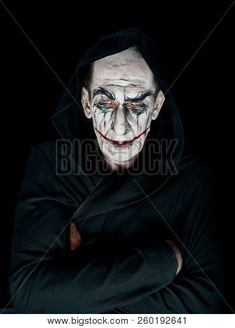 Bloody Halloween Theme: The Crazy Maniak Face On Dark Studio Background