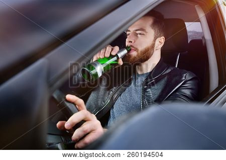 Drinks Alcohol In The Car. The Guy With Beer At The Wheel. Man With Beer. Emergency Situation. Socia