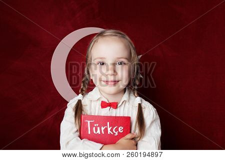 Turkish Language Concept. Cute Child Girl Student On The Turkey Flag Background. Learn Turkish Langu