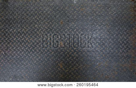 Steel Dirty And Used Checker Plate Metal Sheet. Can Be Use As Background Or Texture.