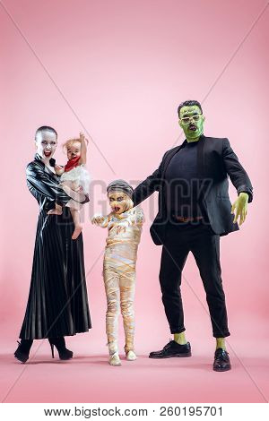 Halloween Family. Happy Father, Mother And Children Girls In Halloween Costume And Makeup. Bloody Th