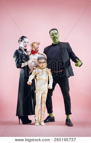 Halloween Family. Happy Father, Mother And Children Girls In Halloween Costume And Makeup. Bloody Th