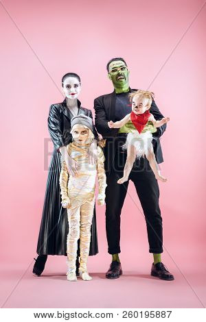 Halloween Family. Happy Father, Mother And Children Girls In Halloween Costume And Makeup. Bloody Th