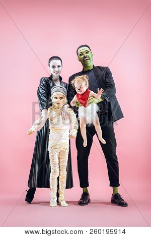 Halloween Family. Happy Father, Mother And Children Girls In Halloween Costume And Makeup. Bloody Th