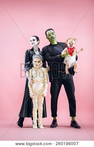 Halloween Family. Happy Father, Mother And Children Girls In Halloween Costume And Makeup. Bloody Th