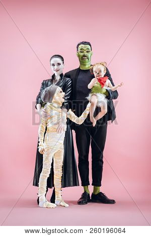 Halloween Family. Happy Father, Mother And Children Girls In Halloween Costume And Makeup. Bloody Th