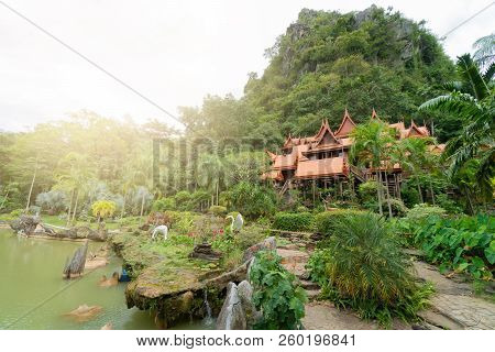 Wat Tham Khao Wong The Temple Is Made Of Teak. Located At The Base Of The Mountain. Surrounded By Tr