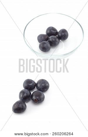 Fresh Black Grapes On White