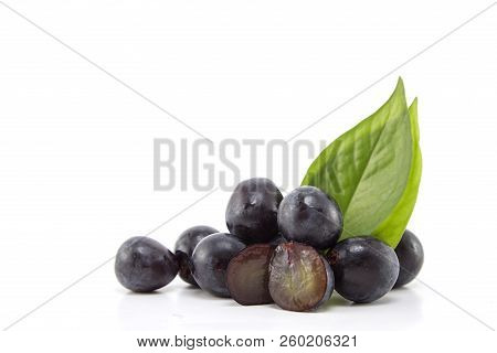 Fresh Black Grapes On White