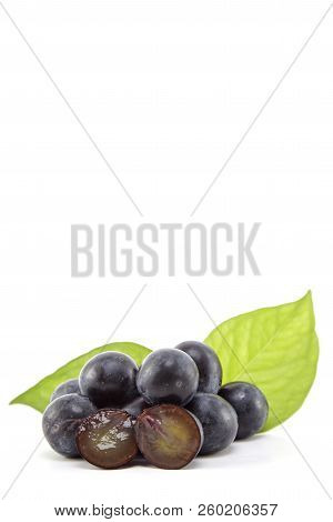 Fresh Black Grapes On White