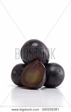 Fresh Black Grapes On White