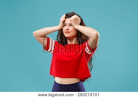 Horrible, Stress, Shock. Female Half-length Portrait Isolated At Blue Studio. Young Emotional Surpri