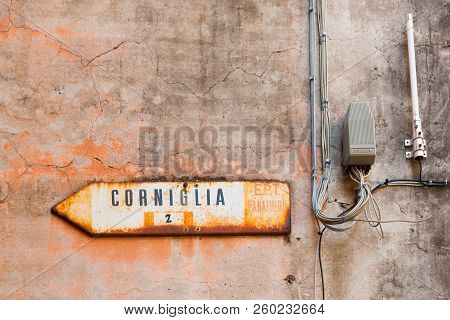 Corniglia Italy - April 26 2011; Street Sign Affixed To Building Wall Point Way To Small Cinque Terr
