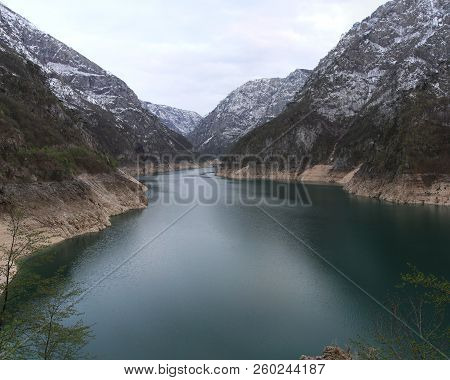 Pivsko Lake Snowy Mountains In Rural Montenegro