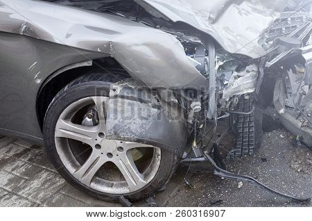 The Car Of A Drunk Driver Skidded And Thrown Out Of The Road Into A Traffic Light Post. A Road Accid