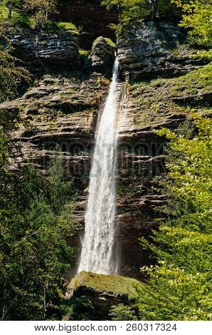 Pericnik Waterfall Surrouned By Trees In Alpine Environment