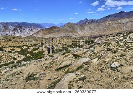 Selective Focus Of Beautiful Colorful Landscape With Two Tourists Following Markha Valley Track In H
