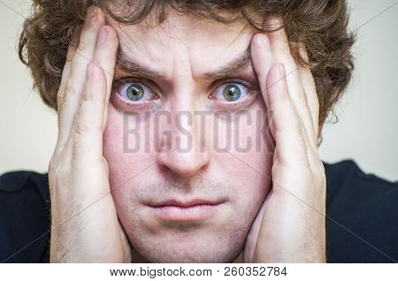 Portrait Of Young Caucasian Ethnicity Stressed Shocked Man Covers His Face With Palms On White Backg