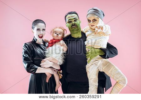 Halloween Family. Happy Father, Mother And Children Girls In Halloween Costume And Makeup. Bloody Th