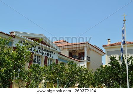 Greek Building In One Of The Nafplion Squares With Its Beautiful Flag. Architecture, Travel, Landscapes, Cruises. July 8, 2018. Nauplion Argolida Greece.