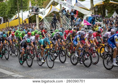 Paris, France - July 23, 2017: Group Of Cyclists On Avenue Des Champs-elysees For The Final Stage Of