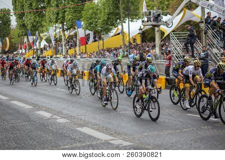 Paris, France - July 23, 2017: Group Of Cyclists On Avenue Des Champs-elysees For The Final Stage Of
