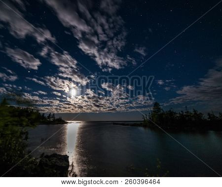 Moonset Over Lake Huron Shoreline In The Dark Night Sky